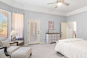 Bedroom with light carpet, access to outside, ceiling fan, and baseboards