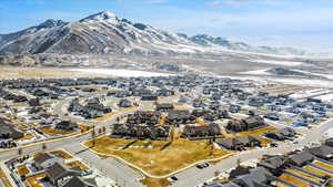 Birds eye view of property featuring a mountain view and a residential view