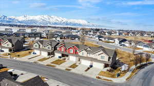 Drone / aerial view with a residential view and a mountain view