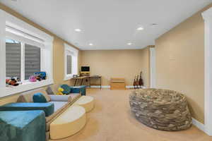 Sitting room with baseboards, carpet, visible vents, and recessed lighting