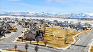 Birds eye view of property with a residential view and a mountain view