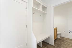 Mudroom featuring baseboards and dark wood-style flooring