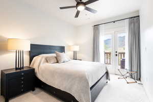 Bedroom with light carpet, access to outside, and ceiling fan