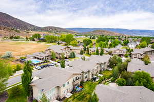 Drone / aerial view with a residential view and a mountain view
