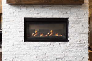 Room details featuring a stone fireplace
