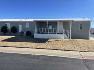 Manufactured / mobile home with covered porch and metal roof