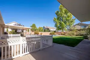 View of patio with fence and a fenced in pool