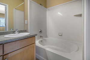 Full bath featuring shower / bathing tub combination and vanity