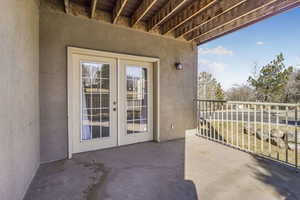 Balcony featuring french doors