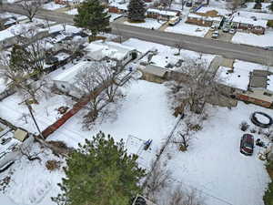 Snowy aerial view featuring a residential view
