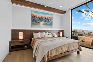 Bedroom featuring recessed lighting, floor to ceiling windows, and hardwood / wood-style floors