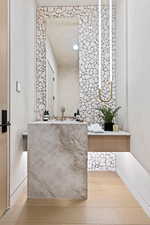 Bathroom with a sink and wood finished floors