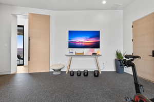 Unfurnished living room with recessed lighting and visible vents