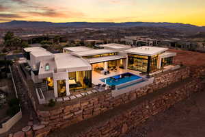 Exterior space featuring a patio, a mountain view, and an outdoor pool