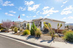 Mediterranean / spanish house featuring a tile roof and stucco siding