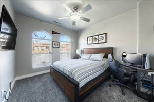 Bedroom featuring a ceiling fan, carpet flooring, visible vents, and baseboards