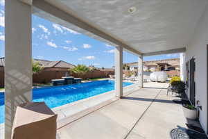 View of swimming pool with a patio area, a fenced backyard, and a fenced in pool