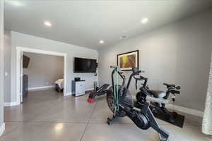 Exercise room featuring baseboards and recessed lighting