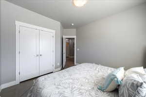 Bedroom featuring a closet and baseboards