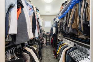 Spacious closet featuring carpet flooring and visible vents