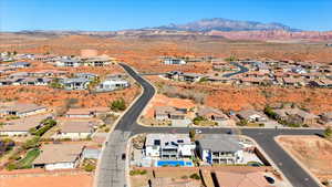 Birds eye view of property with a residential view and a mountain view