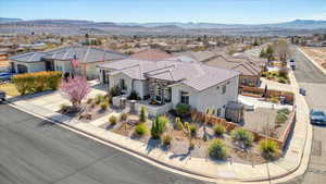 Birds eye view of property with a residential view and a mountain view