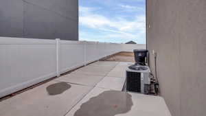 View of patio / terrace featuring cooling unit