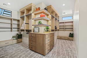 Walk in closet featuring light wood-style floors and visible vents