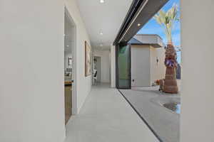 Hall featuring baseboards and recessed lighting