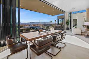 View of patio / terrace with a mountain view and exterior bar