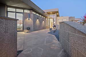 Property exterior at dusk with a patio area