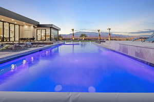 Outdoor pool featuring a mountain view