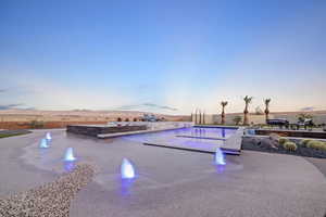 Outdoor pool with a patio area and a mountain view