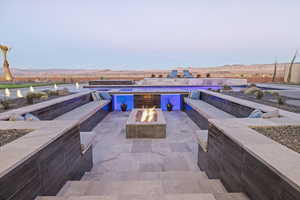 View of patio featuring a fire pit and a mountain view