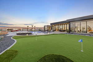 View of swimming pool featuring a patio area and a pool with connected hot tub