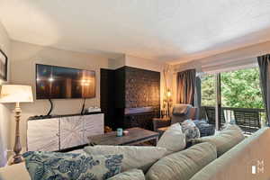 Living area featuring a textured ceiling