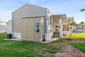 View of outdoor structure featuring an outdoor structure and central air condition unit