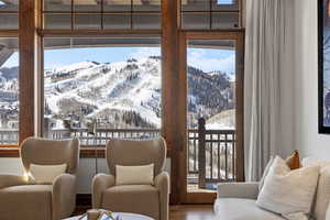 Living area featuring wood finished floors and a mountain view