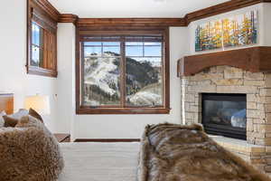 Bedroom with a fireplace and baseboards