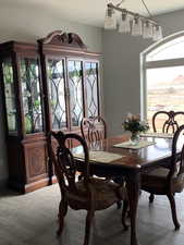 Dining space with plenty of natural light and wood finished floors
