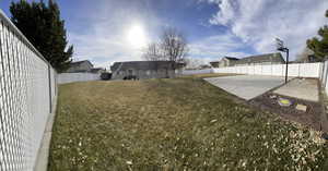 View of yard featuring a residential view, a patio area, and a fenced backyard