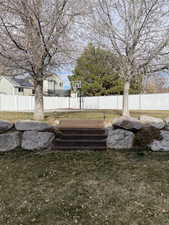 View of yard featuring fence