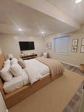 Carpeted bedroom with recessed lighting and baseboards