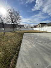 View of yard with fence