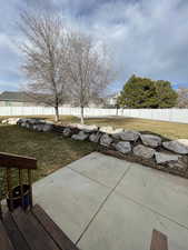 View of patio with a fenced backyard