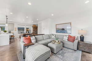 Living room featuring light wood-style floors and recessed lighting