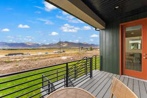 Balcony featuring a rural view and a mountain view