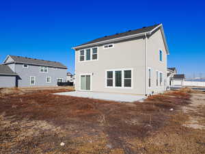 Back of house featuring a patio and stucco siding