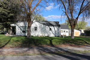 View of front of property with a front lawn