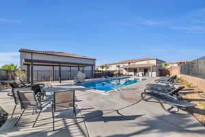 Pool with a patio, a gazebo, and fence